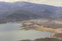  - Lake Pillsbury looking west. Because of the mountainous terrain,1Q5 is not pilot friendly when windy. A 25 kt wind contributed to a fatal C172 accident on 5-8-82. At one time there was a cross wind runway which could have helped this unfortunate pilot. - by S B J
