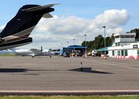  - Apron shot- Flybe/Loganair Dornier G-BYMK waits to depart to Stansted (EGSS), next to visiting Challenger bizjet N354WG - by Clive Pattle