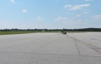  @ Weedon Field Airport - LOOKING OUT FROM FRONT OF OFFICE TO TAXIWAY TO RUNWAY - by dennisheal