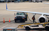  - Pumping fuel onto an aircraft O'Hare - by Ronald Barker
