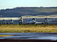  - With a backdrop of the Tay Rail Bridge, a Grob Heron of the based Tayside Aviation prepares to take off. - by Clive Pattle