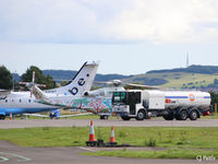  - Refueling action at Dundee Riverside. Helicopter is visiting AW139 ZS-EOS with Flybe Dornier 328 G-BWWT in the rear. - by Clive Pattle