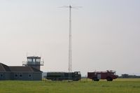  - Control Tower, fuel tender, radio mast and the airport Fire and Rescue tender #2. In the distance (between the two vehicles) can be see an observation tower on the adjacent DIO Pembrey Sands Air Weapons Range (EGOP).  - by Roger Winser