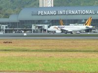  - Two Tiger Air A320 at Penang. - by Afif Idris