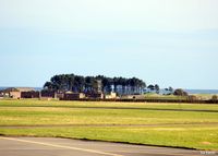  - A view from the hump towards the former HAS site of 111 Sqn at RAF Leuchars. At the time of the photograph all the resident fast jet squadrons Nos 1 and 6, with their BAe Typhoons, have already vacated their HAS's and moved to RAF Lossiemouth.  - by Clive Pattle