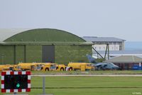  - WWII hangar with modern build behind at RAF Lossiemouth EGQS - by Clive Pattle