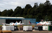  - An unusual view of the GA area at Dundee Riverside airport, viewed through the fence. - by Clive Pattle