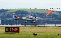 - A view across the airfield towards the River Tay with a Grob Heron of the based Tayside Aviation about to land yet again. - by Clive Pattle