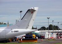  - A view of the maintenance area at Dundee Riverside, with the tail of a Dornier 328 parked at the Loganair/Flybe engineering facility at the airport. - by Clive Pattle