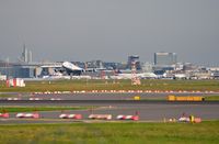  - FRA, overlooking 3 runways with the terminal in the distance and the Frankfurt skyline behind it. - by FerryPNL
