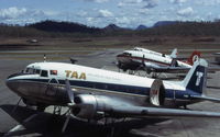  - A trio of Douglas DC-3's at Port Moresby Airport, each in a different color scheme. This was the transition period for the newly formed Air Nuigini. Photo taken December 1974 - by Peter Lea