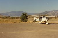  - N6905D at Kern Valley airport were you can still park near a river and camp.Few of this type of airports remaining. The Kern river is a 5 minute walk from your plane and Lake Isabella can be seen in the distance. - by S B J