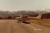  - N8059X on the ramp at Alpine Co airport in Calif around 1981 with view to the south.The beautiful snow capped Sierra Nevada mountains are in the background. - by S B J