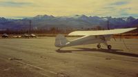  - N39932 at lovely Bridgeport and the awsome Sierra Nevada mountains (fantastic backpacking country and challenging flying) in the background.Those mountains are in the 11K-12K feet range.View is to the south. - by S B J