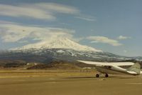  - N4385E at the Weed airport with spectacular Mt Shasta (14,162 feet) in the distance.There has been a few planes that bumped into it over the years like a Beech on 9-16-92. Most often at night or in inclement weather. - by S B J