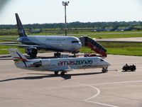  @ Viru Viru International Airport - A CRJ-200 of Amazsonas (CP-2742) being towed in front of the B767 of BOA (CP-2881).  In the back, three B727 and one B737 of Aerosur, all out of service  - by confauna