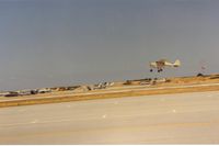  - N2371P crabbing on takeoff at San Carlos airport in a typical summer afternoon wind condition.Notice windsock behind 71P.Better brush up on crosswinds if you fly out of San Carlos. The wind is most often as seen due to the cool coast  and warm valley east - by S B J