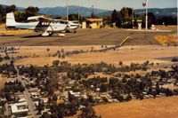  @ Round Valley Airport - The Round Valley airport ramp and air view of the small town of Covelo which is a short distance away.This was in 1992.The ramp view is looking toward town or east and town view is to the north. - by S B J