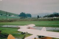  - Private strip a few miles NW of Gnoss (DVO).Was a demanding ( narrow & elevated ) runway that was a  one way strip (power lines) for low power planes when I landed there in 1990. View is to the NE. Cars are on Hy 101. - by S B J