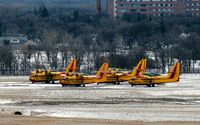  - Several Canadair CL-415s owned by the Province of Manitoba parked for the winter. - by Kreg Anderson