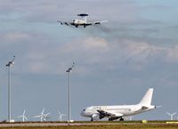  - Outgoing traffic on twy A8 is observing AWACS-707 on final for rwy 26R..... - by Holger Zengler