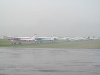  - In the torrential rain of a tropical storm - flying club ramp - by magnaman