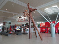  - nice art piece inside international terminal - check in level - by magnaman