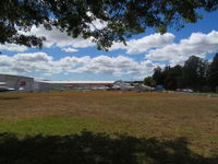  - Dennis Thompson aircraft sales area on grass at Ardmore - by magnaman