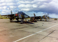  - 16 (R) Sqn ramp at RAF Lossiemouth EGQS in October 1995 showing two of the Sqn's Sepecat Jaguar T.2's awaiting their next training sortie. - by Clive Pattle