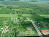 SLBU, Passing by before landing, Baures' paved access road and grass airstrip, ca. 2007, photo by confauna