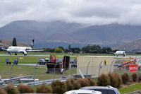  - Two aircraft on the same active runway: The one on the left is taxing for take-off, and the one on the right just landed and is backtracking to the exit. - by Micha Lueck