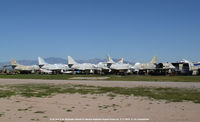  - A-4C and A-4L Skyhawks in out door storage. - by J.G. Handelman
