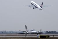  - Outbound MAC traffic leaves rwy 26R meanwhile business traffic comes along twy Charlie... - by Holger Zengler