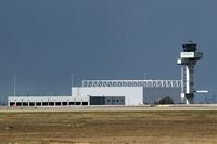  - In front fire station east and in the back AN-124 hangar at apron 3 and tower (view from a hill at DHL fuel station)..... - by Holger Zengler