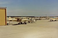  - N2371P at San Carlos in 1988.View is  north and the administration building (flag) and  Sky Kitchen. Notice two airliners above 71P on (short) final to SFO.Was interesting flying under them (tower gave advisorys) when departing to the east. - by S B J