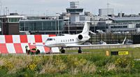  - being pulled by an landmark FBO tug on the the landmark FBO ramp - by andy-man-egcc