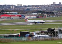  - A newly arrived BA A320 taxies from the runway at Aberdeen EGPD. Note the fire training area (with ex RN Jetstream T.2 and ex RAF Jaguar GR.3) in the foreground and the parked Bond Helicopters and GA park in the background - by Clive Pattle