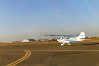  - 69B with owner Jim at the controls, takes runway 30 at the Tracy,Ca. airport . - by S B J