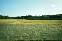  @ 074 - Redding Sky Ranch,Redding,Ca.Always loved airports called Sky Ranch.View is to the West and the crosswind runway ( upslope and trees at the west end ) with the few hangars the airport had.Was closed in 1993. - by S B J