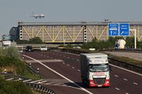  - Inbound traffic on rwy 26L on final. In front airport parking garage at Autobahn 14. From windows on the left you can take pretty pics of aircrafts passing rolling bridge from and to rwy 08L/26R.... - by Holger Zengler