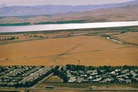 @ N112 - Santa Nella airport,Ca.was a private-public use airport from mid 50s-90s.Used for parachuting in the last years.San Luis Reservoir seen at the very top of pic. which is near Los Banos,Ca.Landed there many times. View is SW. - by S B J