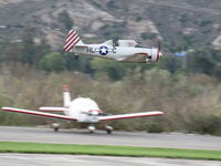  - Condor Squadron making another high speed flour bomb pass at riverbed target, Commemorating 7 Dec. 1941 attack on Pearl Harbor. Official scorers were near Rwy 04 windsock cordoned off area. - by Doug Robertson