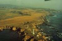  - Point Arena lighthouse helicopter pad on the beautiful North Calif. coast.This picture (1992) shows better the possible dirt runway. Was told the final (touching) scene in the 1992 movie Forever Young with the B25 landing near the water, was filmed here. - by S B J