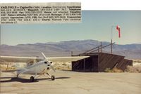  - Eagleville airport which was closed around 2000 was a nice little airport in NE calif.While it was in Ca,the mountains seen are in Nevada.This stop was in 1988. This nice hangar was the only structure at the airport. - by S B J
