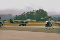  - End of airshow with planes ready for departure as Tcraft lifts off.Notice the fog which was always a concern.Reason airshow moved to end of year.Weather prevented me from attending two airshows (attempted but turned back) in the 80s. - by S B J