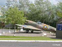  - A view of the 609 (West Riding) Sqn RAF memorial building and FSM Spitfire on external display at the Yorkshire Aviation Museum, Elvington. - by Clive Pattle