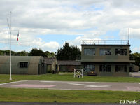  - A view of the watchtower and nissen hut buildings at the Yorkshire Aviation Museum, Elvington. The Tricolor flies at the mast head as a memorial to the members of the French Sqns based at the airfield in WWII - by Clive Pattle