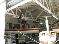  - 12 CURTISS TAXI, huge collection of model aircraft, including donation collections from Naval Aviators. This hangar open First Sundays with absolutely countless aircraft models on display. - by Doug Robertson