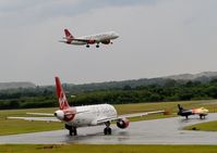  - Virgin A320-214 EI-DEO Landing runway 06 while Virgin A320 EI-EZW And Hunter G-PSST Hold  - by Mike stanners