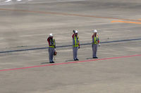  - I love that friendly gesture of ground staff waving flights good-bye. I have only ever seen it in Japan and in Hawai'i - by Micha Lueck